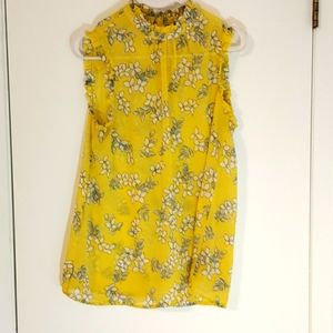 Yellow floral blouse.